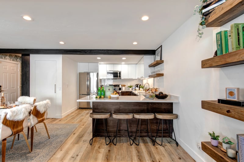 This kitchen view shows the clean, airy layout perfect for group cooking or quick breakfasts.