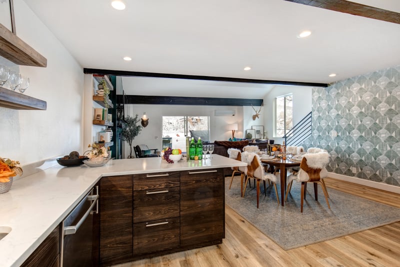 Enjoy morning coffee or cocktails at the spacious island, just steps from the dining table.