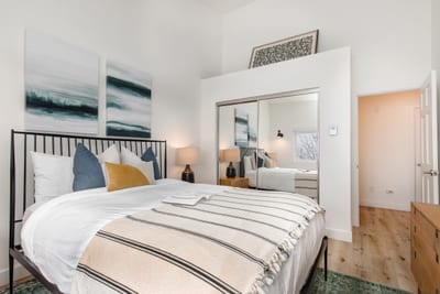 Sleep soundly in this main-level guest room with Queen bed, nightstands, and cozy linens.