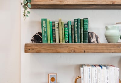 Thoughtful touches like curated books and greenery bring warmth and charm to your space.
