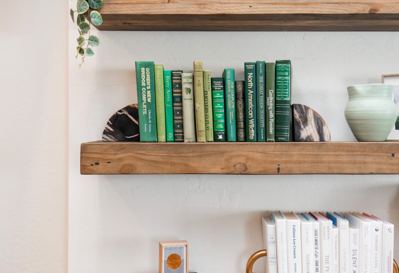 Thoughtful touches like curated books and greenery bring warmth and charm to your space.
