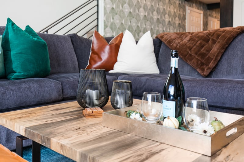 Relax with a drink or snack on the coffee table, surrounded by plush seating and mountain views.