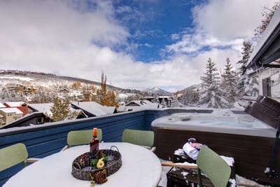 Enjoy alpine views and crisp mountain air from your private upper-level deck with outdoor dining.