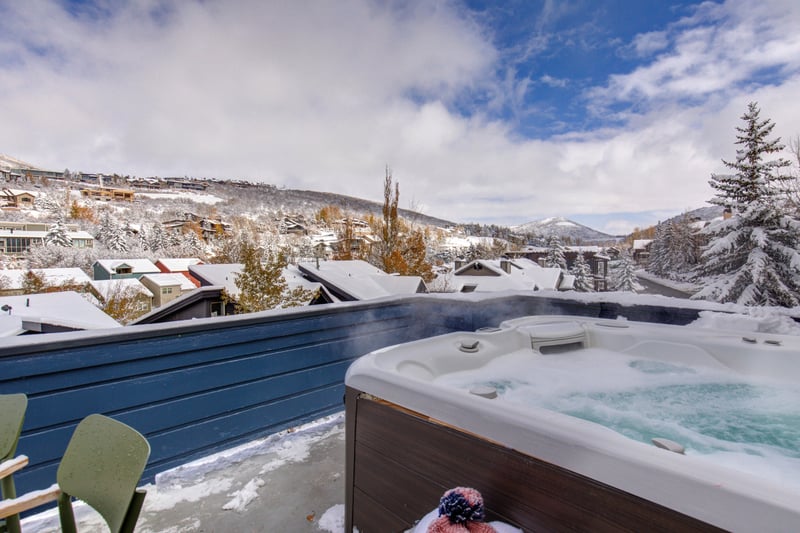 Relax in the hot tub while enjoying elevated views of the slopes and town below.