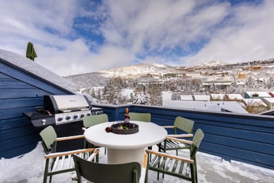 Grill year-round on your private balcony while taking in snowy mountain views.