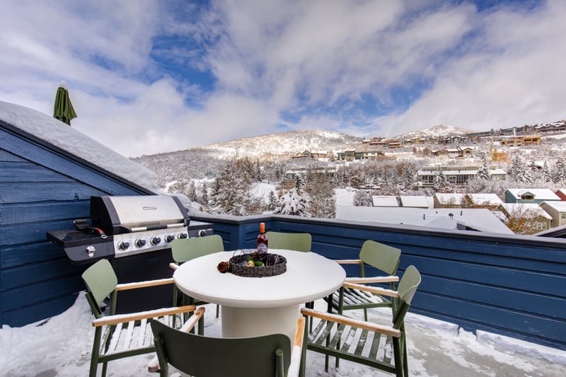 Grill year-round on your private balcony while taking in snowy mountain views.