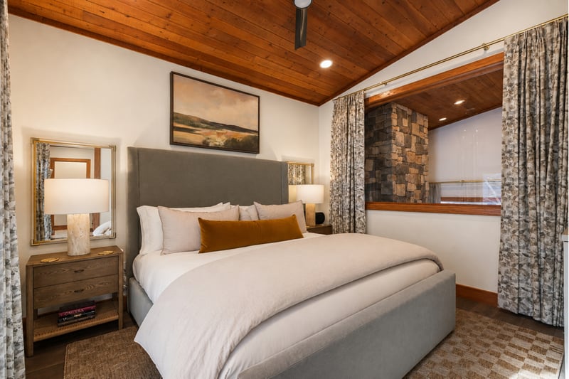 Rustic wood ceiling, stone accents, and modern comfort.