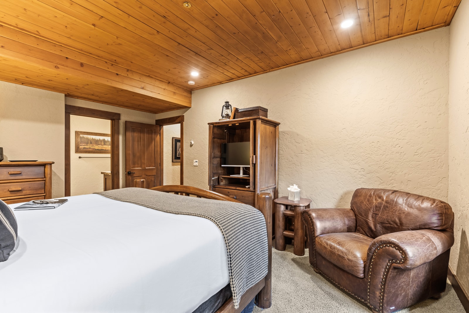 Additional seating and natural light make the master a restful retreat at any time of day.