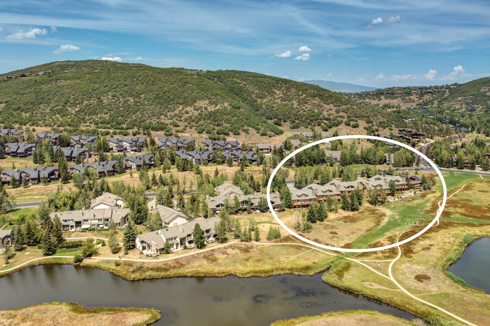 Aerial view shows your home’s prime location near open space, trails, and nearby ski areas.