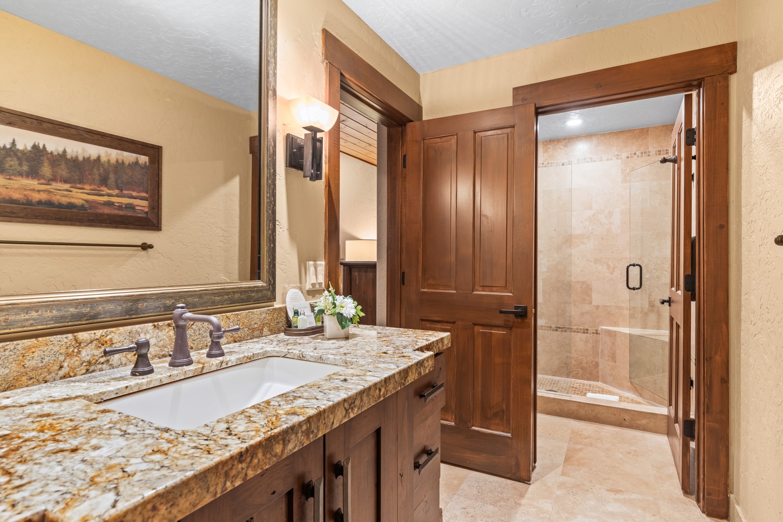Your en suite bath includes granite counters, dual sinks, and L’Occitane amenities for a luxe refresh.