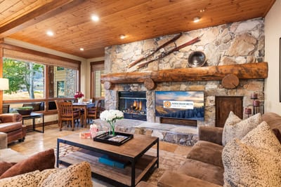 Open-concept living with a central fireplace creates an inviting space to relax, connect, and enjoy downtime.