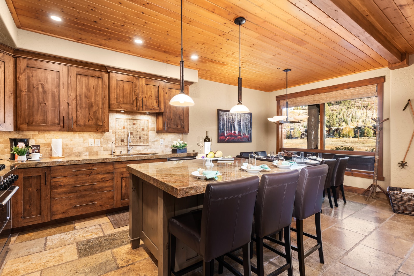 Spacious kitchen with island seating flows easily into dining and living, ideal for cooking and conversation.