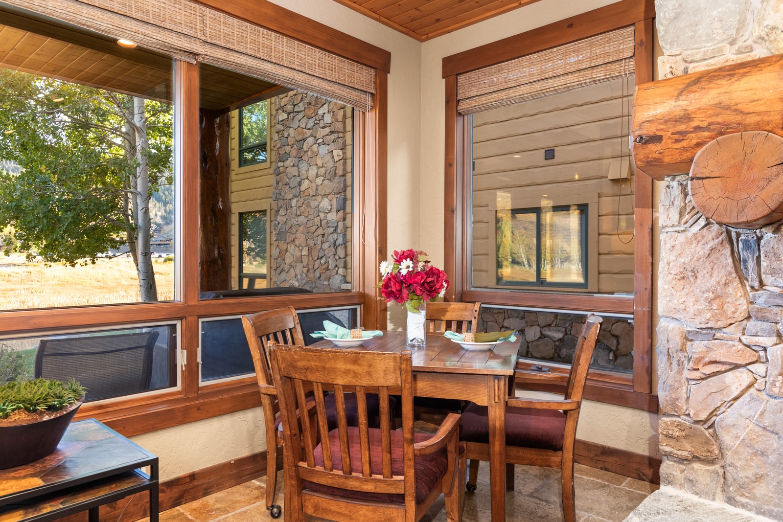 This window-side reading nook is a peaceful corner for morning coffee or planning your day in the mountains.