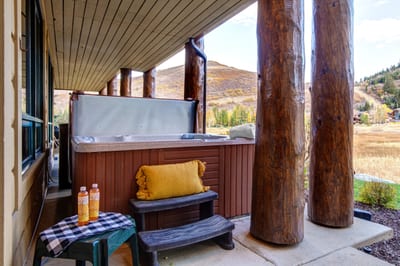 Private hot tub under covered deck invites you to soak while watching the sunset or the snow fall.