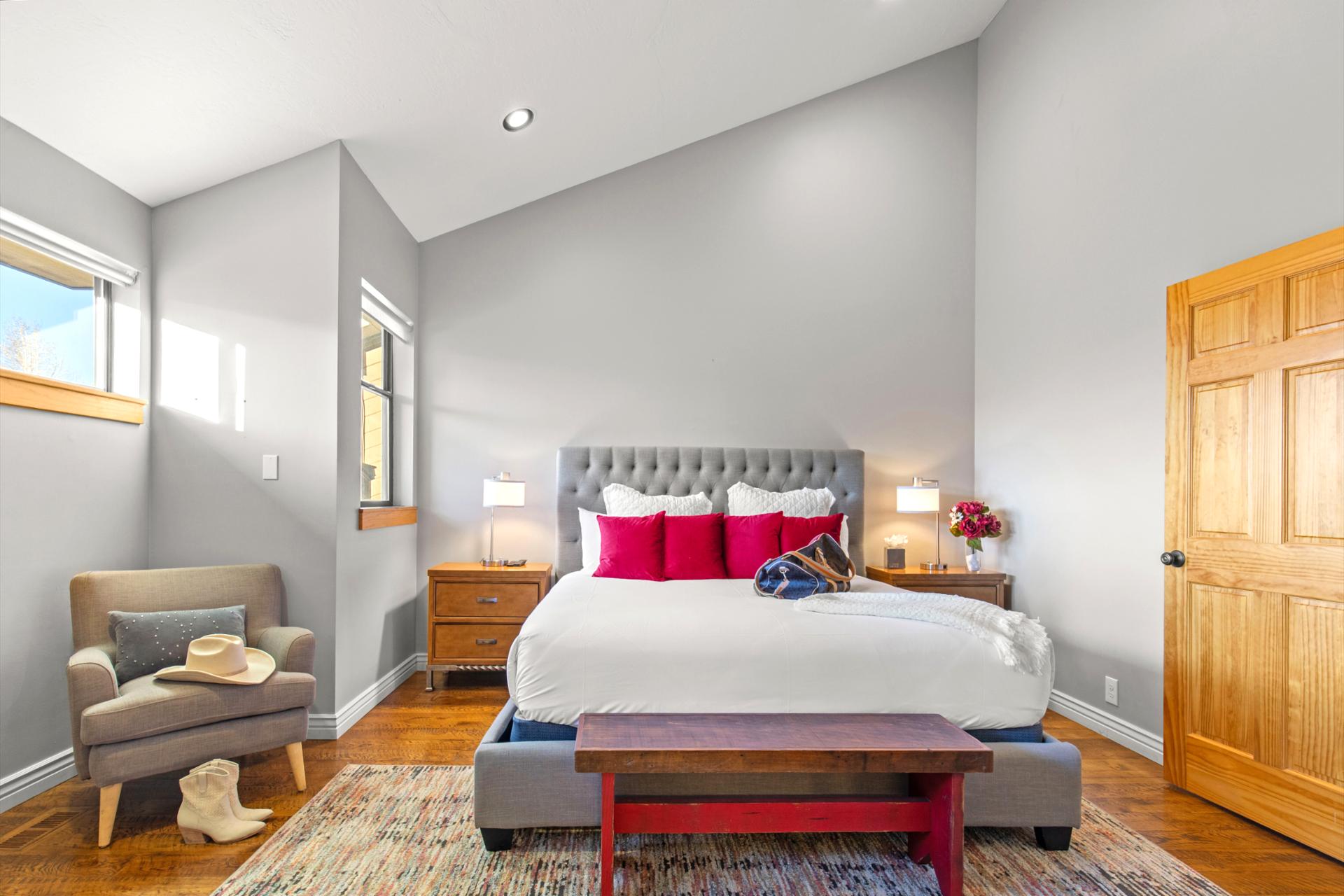 Cathedral ceilings offering warmth and brightness to your primary bedroom