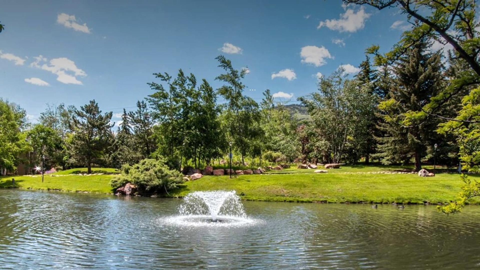 Relax by the tranquil pond just steps from your mountain retreat.