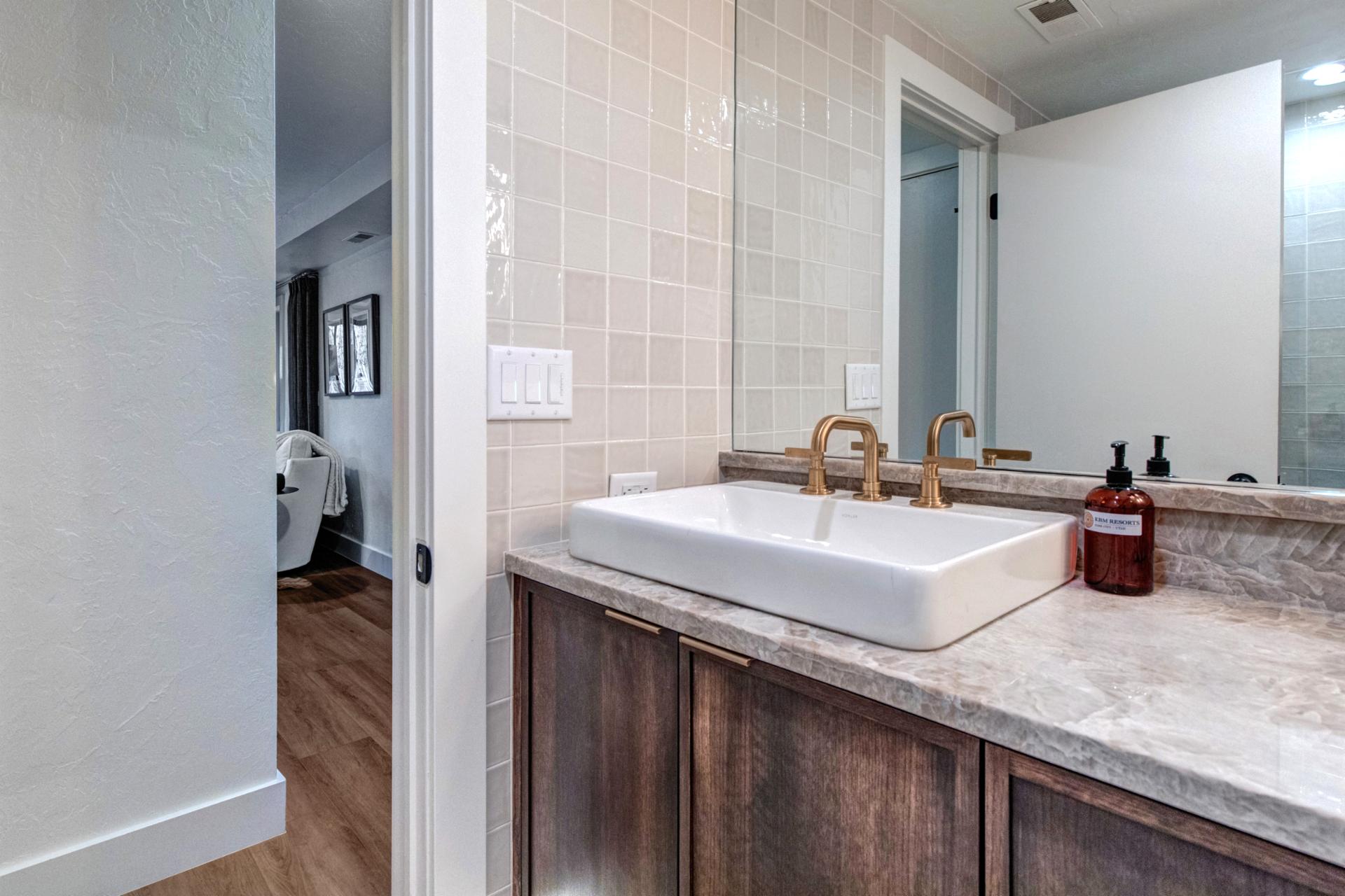 Located on the main level, this full size bathroom has a step-in shower, great for all guest rooms to share.