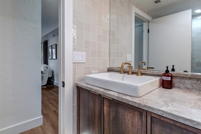 Located on the main level, this full size bathroom has a step-in shower, great for all guest rooms to share.