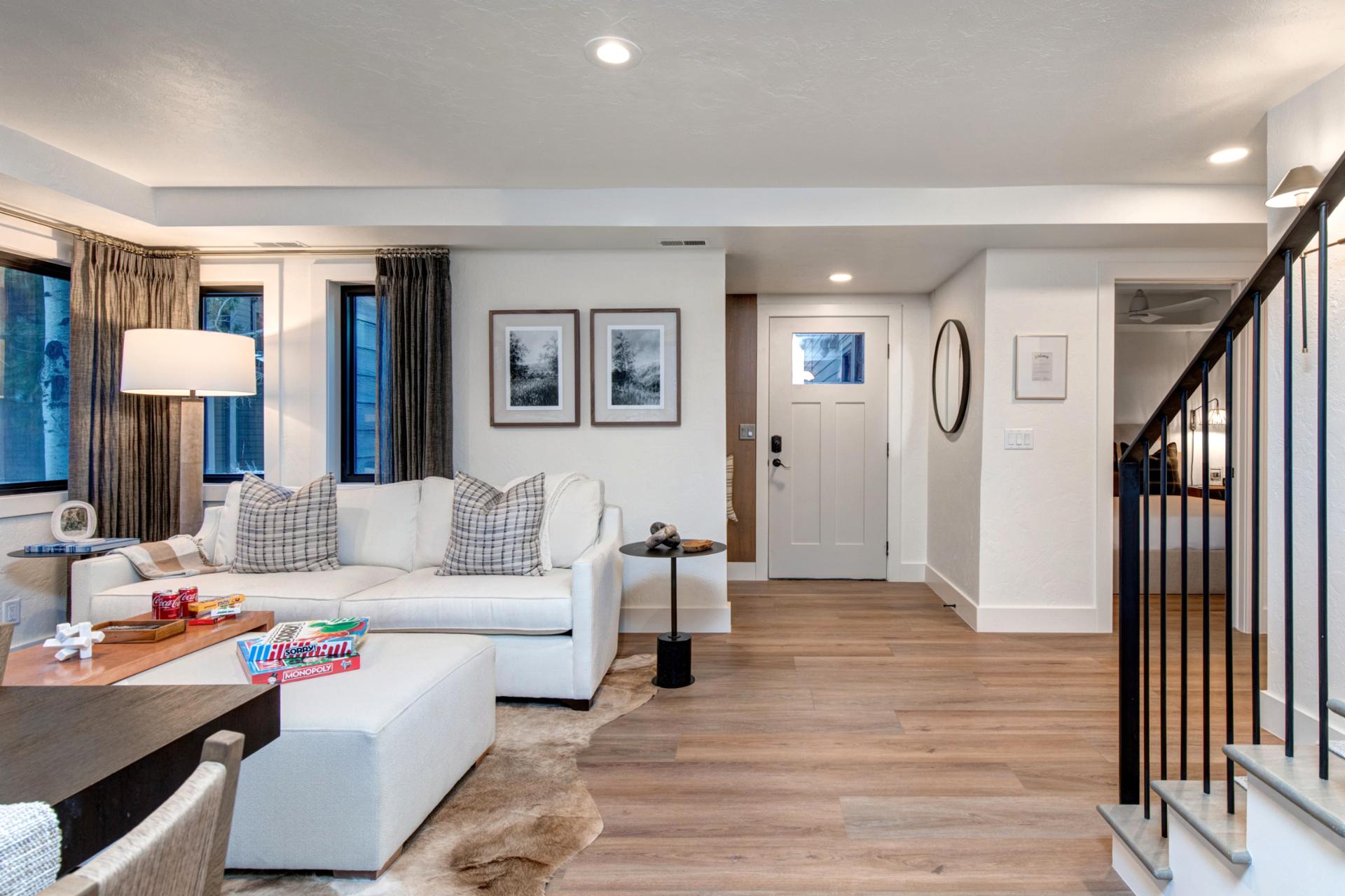 Wood floors, brightly lit, and comfortable seating