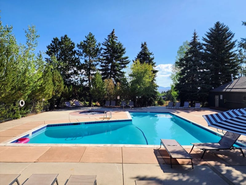 Take a dip in the common area outdoor pool surrounded by mountain views.