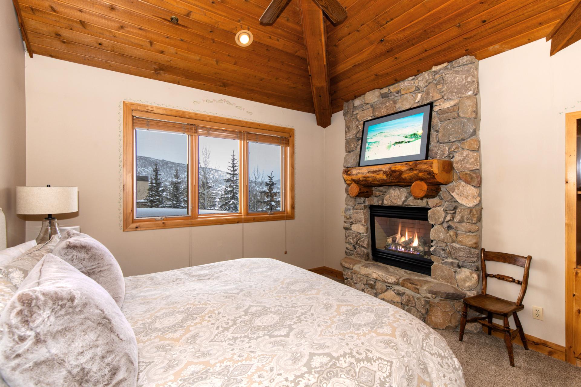 Rest well in your upper-level primary suite with a King bed, private deck access, and vaulted ceilings for a spacious, retreat-like feel.
