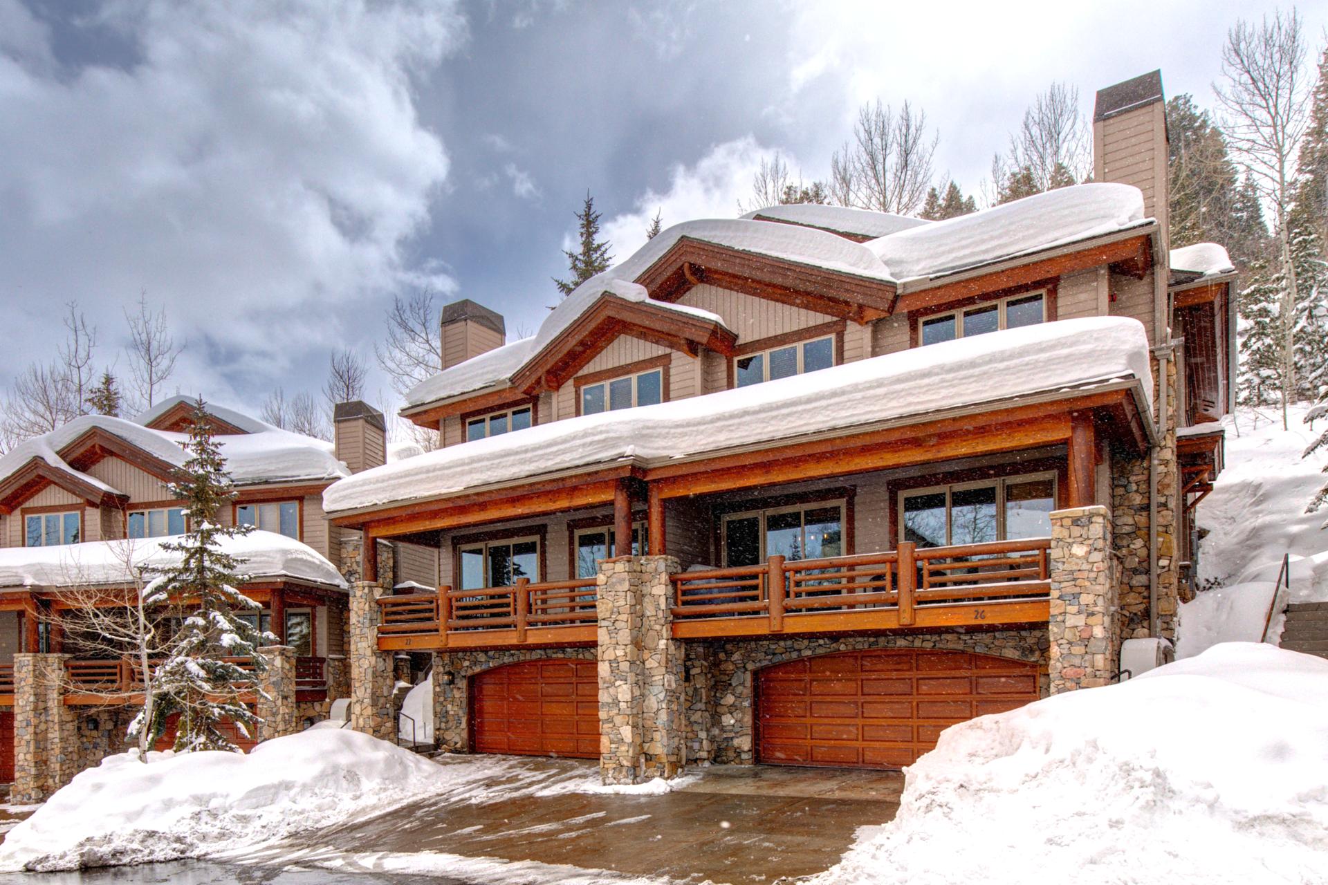 Arrive with ease to this welcoming mountain townhome, tucked among snowy trees with convenient access and classic alpine charm.