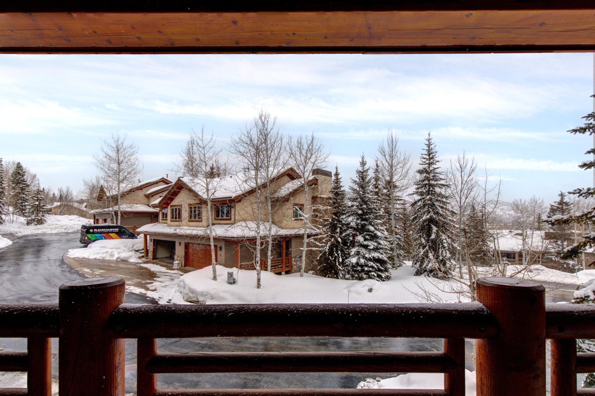 Enjoy tree-framed mountain views from your upper-level balcony. A peaceful spot for morning coffee or sunset reflection.