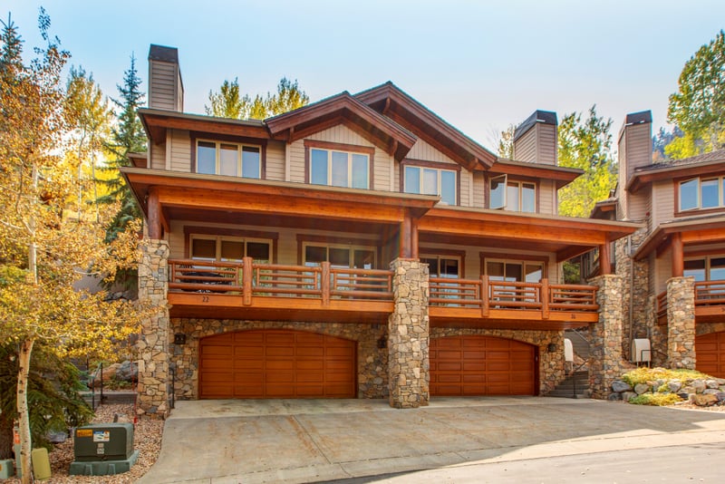 Enjoy year-round curb appeal with a private garage and spacious balconies, set among mature trees in a quiet mountain enclave.