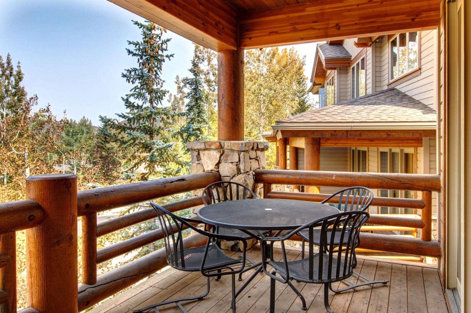 Breathe in fresh mountain air from your covered deck, perfect for morning coffee or après-ski wine with serene treetop views.