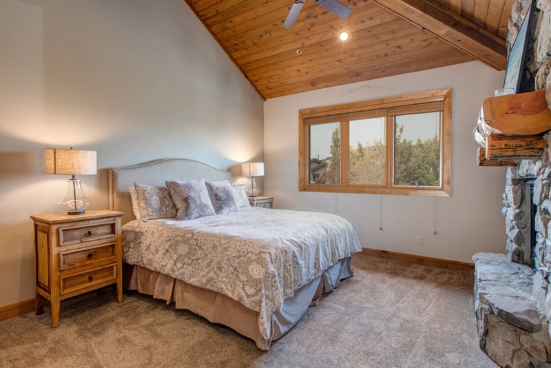 Unwind in your serene upper-level primary suite with a King bed, high ceilings, and a soft neutral palette for restful nights.