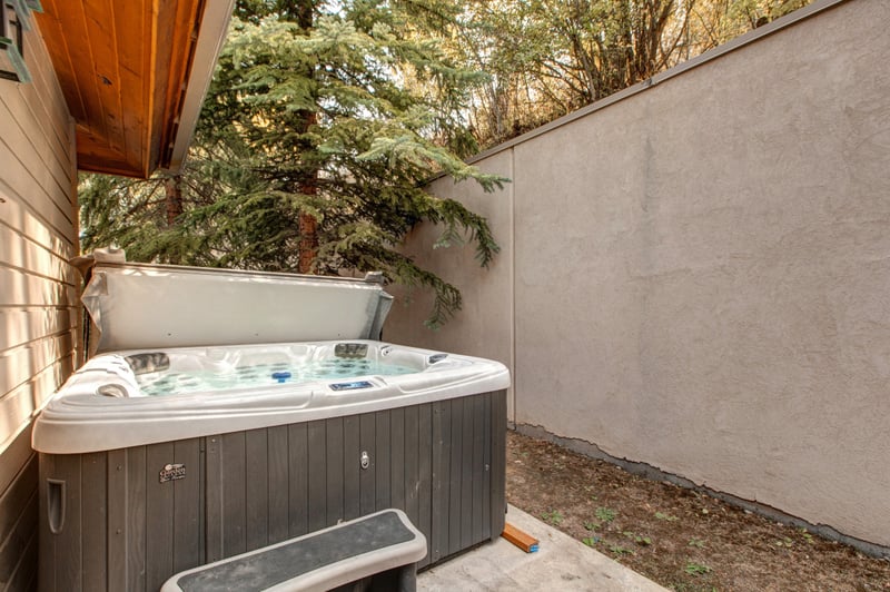 Step outside to your private, walled-in hot tub for a relaxing soak beneath the stars or snowflakes.
