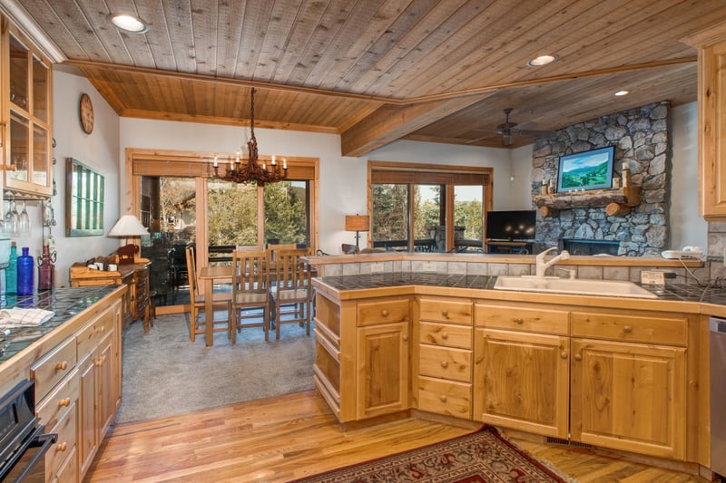 Ample counter space and bar seating make this kitchen perfect for prepping meals or chatting over breakfast before a day out.