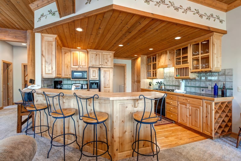 The kitchen island with seating invites casual dining or snacks between outdoor adventures, all in an open and social layout.