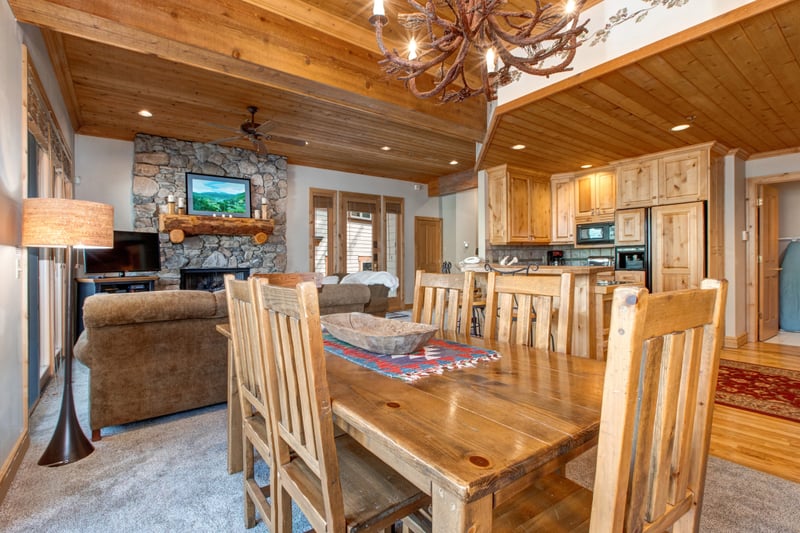 Dine beneath rustic beams with a table that seats eight comfortably. Great for holiday dinners or casual evenings in.