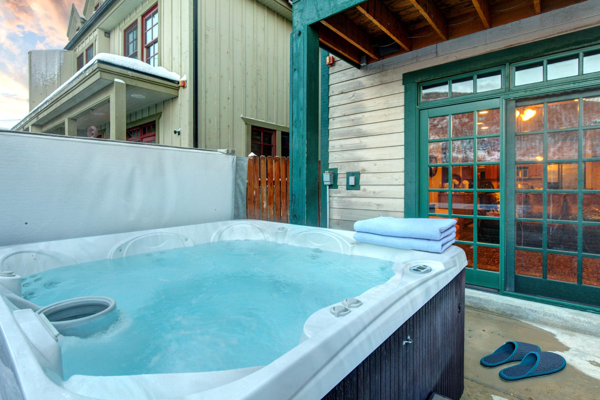 Step outside to your private corner hot tub 