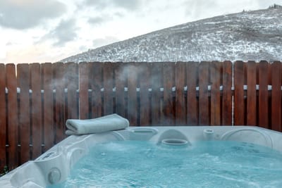 Soak under the stars or après-ski in your private fenced-in hot tub with hillside views. PPS-1416