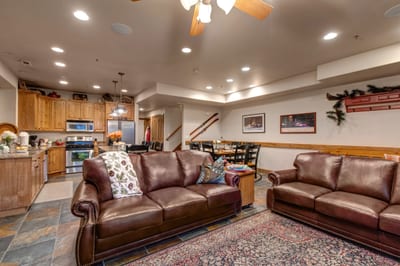 An alternate angle shows cozy seating, high ceilings, and warm wood accents throughout. PPS-1416