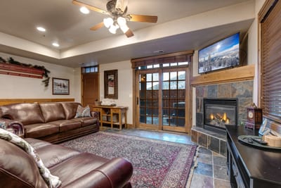 Settle in by the fireplace after a day outdoors in this warm, inviting space. PPS-1416