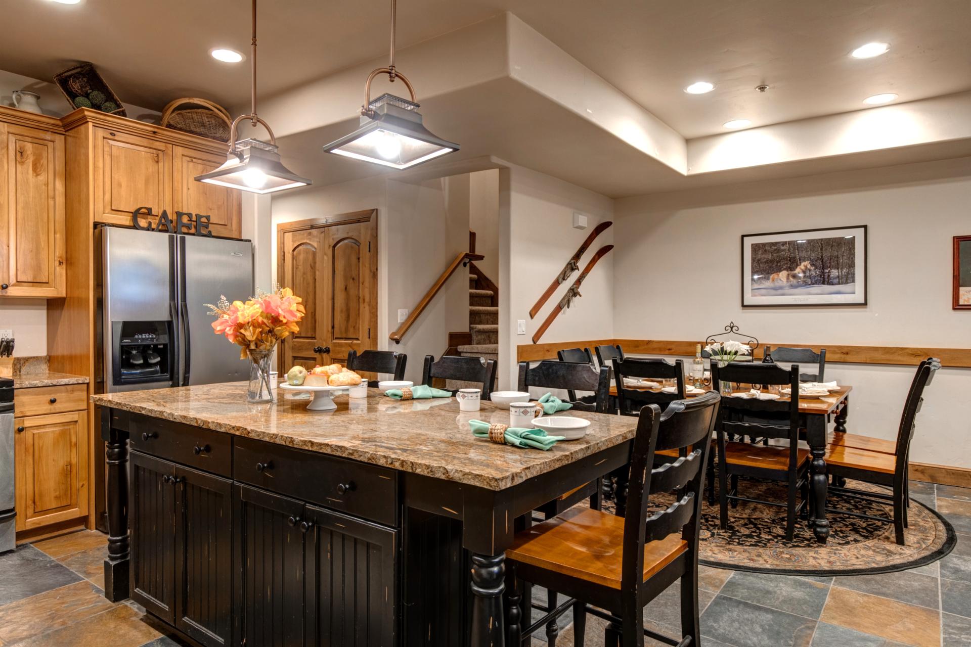 Full kitchen includes generous counter space and rustic styling for meals in.