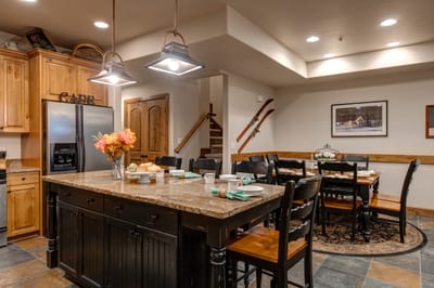 Full kitchen includes generous counter space and rustic styling for meals in. PPS-1416