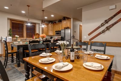 Share meals at your large dining table for eight with ski decor and mountain lodge vibes. PPS-1416