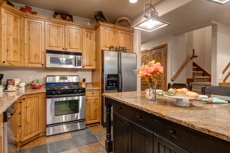 Spacious layout features a center island, pendant lighting, and access to the dining area. PPS-1416