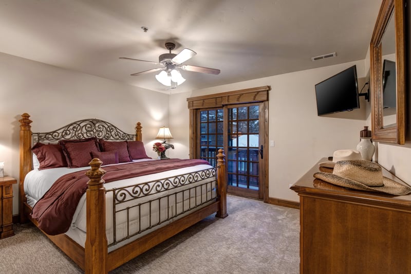 Sleep soundly in the King bed with mountain views, ceiling fan, and private balcony access. PPS-1416