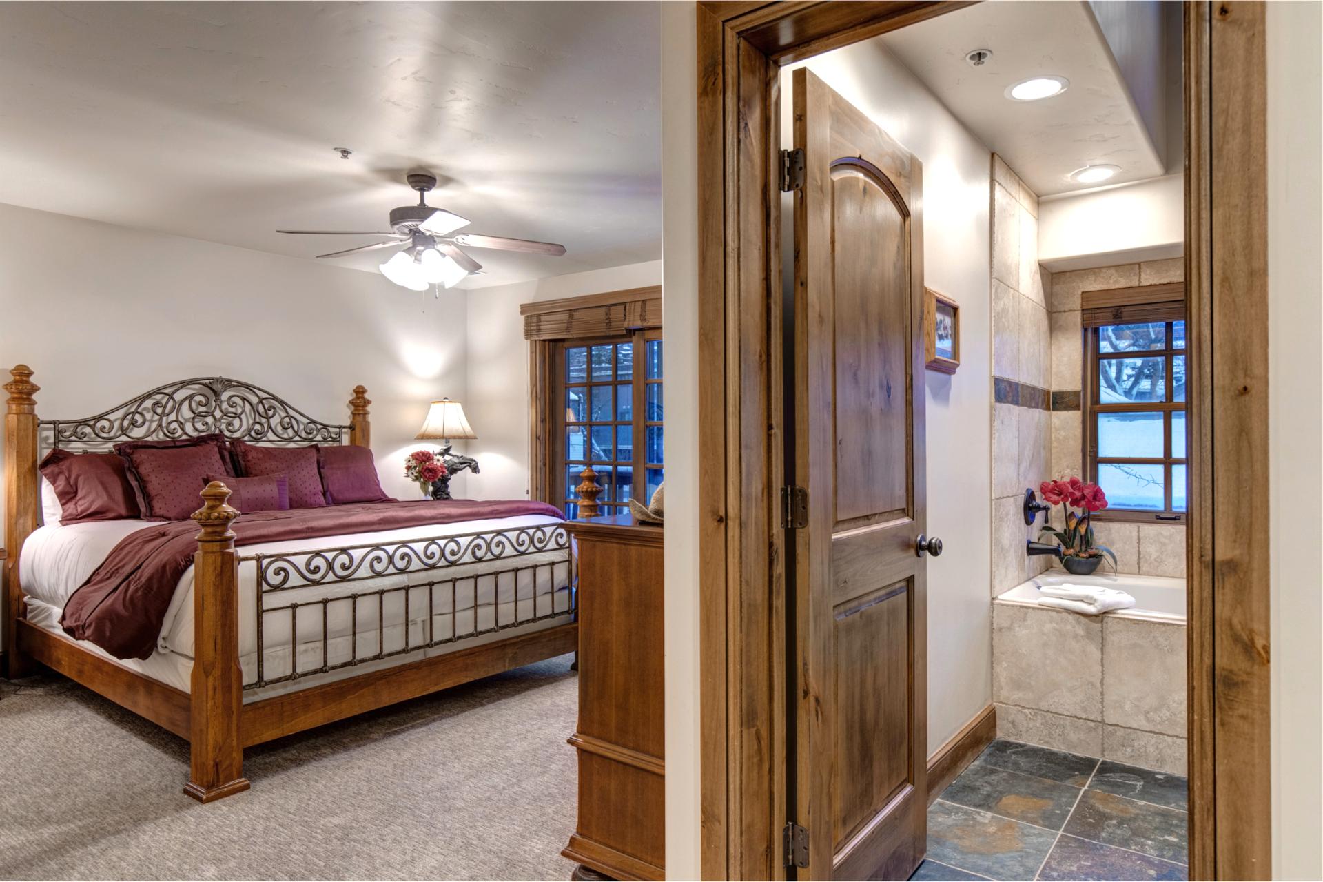 Primary suite with step in shower and separate soaking tub, private vanity area, and access to your own deck