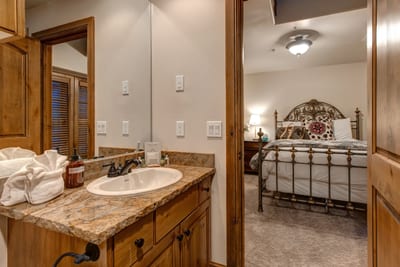 Rustic granite vanity and wrought full jack n jill bathroom for the two queen bedrooms