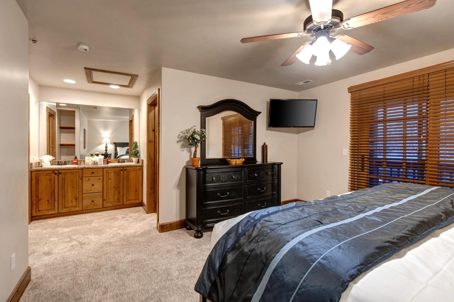 En suite king size bedroom with full bathroom, step in shower and separate soaking tub