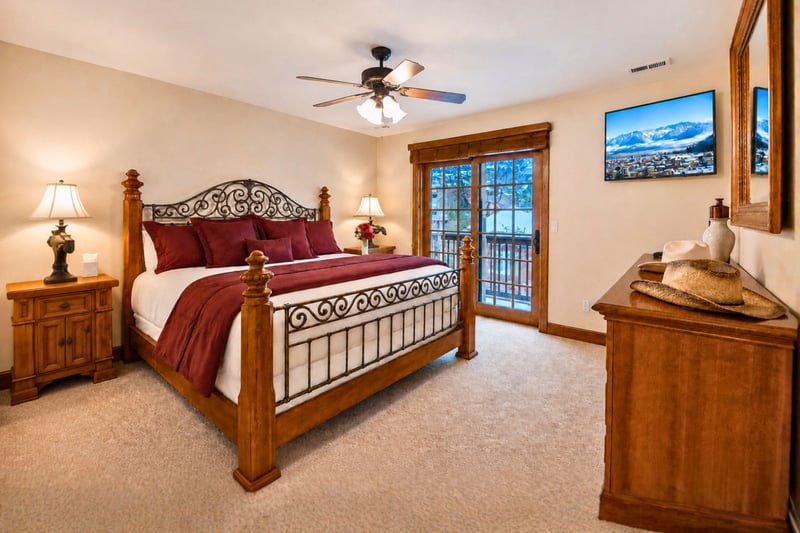 Sleep soundly in the King bed with mountain views, ceiling fan, and private balcony access. PPS-1416