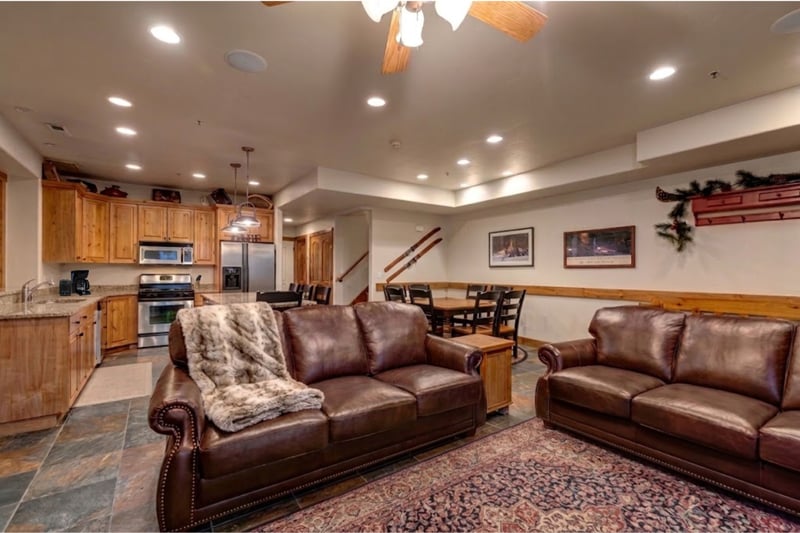 An alternate angle shows cozy seating, high ceilings, and warm wood accents throughout. PPS-1416