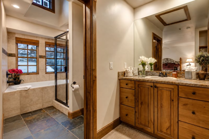 The en suite features a granite dual vanity, walk-in shower, and separate soaking tub. PPS-1416