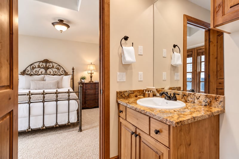 Jack-n-Jill Guest Bathroom 1 includes granite counters, shower-tub combo, and quality finishes